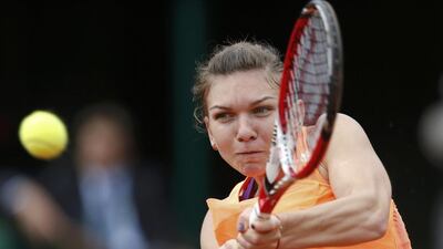 Simona Halep of Romania returns a backhand to Sloane Stephens of the United States during their women's singles match at the French Open on June 2, 2014. Vincent Kessler / Reuters