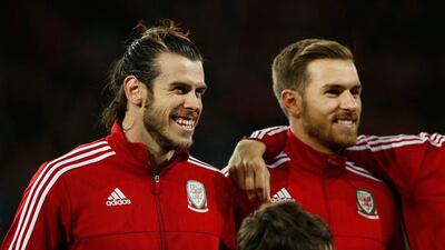 Wales players Gareth Bale and Aaron Ramsey shown before the anthems on Tuesday night at their Euro 2016 qualifying match at the Cardiff City Stadium. Stu Forster / Getty Images