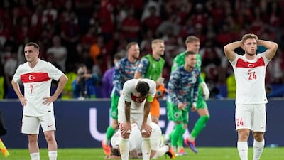 Dejected Turkey after their quarter-final defeat. AP