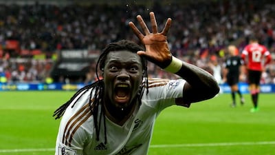 Swansea City striker Bafetimbi Gomis celebrates after scoring his team's second goal during their Premier League match against Manchester United on Sunday. Stu Forster / Getty Images
