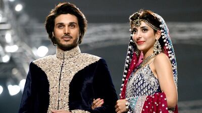 Models present creations of designer Zainab Chottani. Rizwan Tabassum / AFP photo