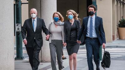 Elizabeth Holmes walks with her partner Billy Evans and her parents, to the federal court to hear the verdict in her fraud trial in San Jose, California, January 3. AFP