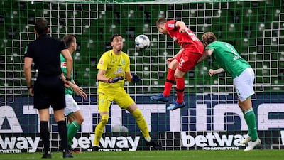 Mitchell Weiser, center, of Leverkusen scores his team's 3rd goal during the German Bundesliga soccer match between Werder Bremen and Bayer Leverkusen 04 in Bremen, Germany. AP Photo