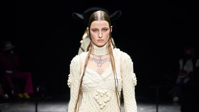 At Jean Paul Gaultier, a dress and matching bolero jacket is made from argyle knit.