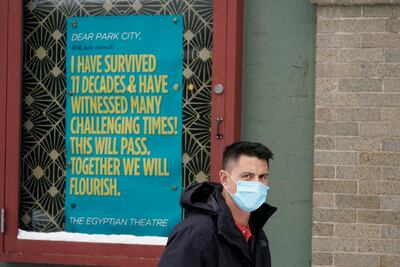 A man walks past the Egyptian Theatre on Thursday, in Park City, Utah. AP