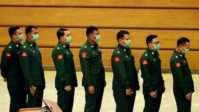 Military representatives queue to cast their votes to amend the 2008 Constitution at Union parliament on Tuesday, March. 10, 2020, in Naypyitaw, Myanmar. AP