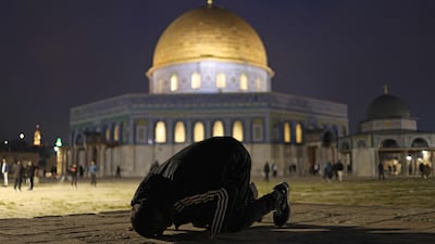 Worshippers gather near the Dome of the Rock at Al Aqsa Mosque in Jerusalem for fajr prayers after the compound reopened. AFP