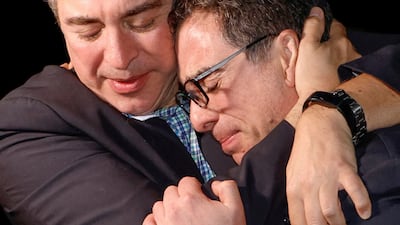 A family member embraces Mr Namazi who was imprisoned for almost eight years. Reuters