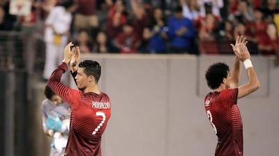 Portugal's Cristiano Ronaldo and Pepe applaud the crowd after beating Ireland 5-1 on Tuesday night as they get in their final preparation before heading to Brazil for the 2014 World Cup. Ray Stubblebine / Reuters / June 10, 2014