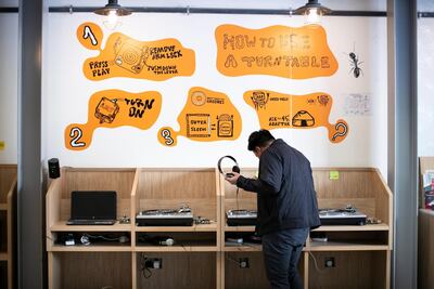 Jedd Peralta works at record store The Flip Side, in Alserkal Avenue. Reem Mohammed / The National