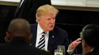 US President Donald Trump speaks with guests at the start of an Iftar dinner at the White House in Washington, on June 6, 2018. Joshua Roberts / Reuters
