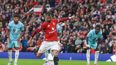Manchester United's Bruno Fernandes score from the penalty spot against Burnley at Old Trafford. AP