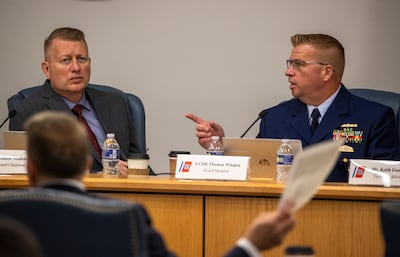 Board chairman Jason Neubauer, left, and board member Thomas Whalen of the investigative board for the Titan submersible appear at a formal hearing. The Post and Courier / AP