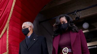 Former president Barack Obama and Michelle Obama, in Sergio Hudson, arrive before the inauguration of Joe Biden. EPA