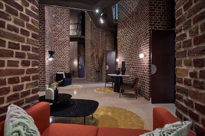 The ground floor is an aesthetic maze of redbrick passages and pillars. Photo: Hilton
