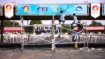 Workers prepare Boutheib Endurance Village for the endurance race beginning on Thursday. Victor Besa / The National