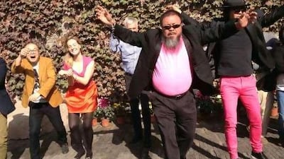 The dissident Chinese artist Ai Weiwei dances with his friends as they make a cover version of music video of Gangnam Style. Reuters