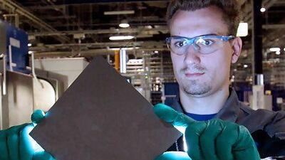 SolarWorld, one of Germany's biggest panel producers, yesterday opened a showroom for its products at the Dubai Creek. Above, an employee at the the company's manufacturing plant in the German city of Freiberg. Sebastian Willnow / AFP