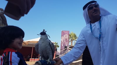 Abudullah Hammadi and pet falcon Hirjeel at the Abu Dhabi F1 Heritage Village. Courtesy: Saeed Saeed.