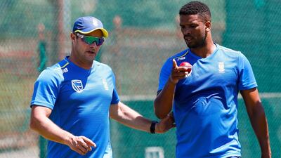 South Africa's head coach Mark Boucher, left, speaks with bowler Vernon Philander during a net session at the Supersport Park Cricket Stadium in Centurion. AFP