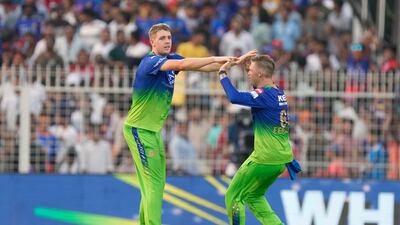 Royal Challengers Bengaluru's Cameron Green, left, celebrates the wicket of Kolkata Knight Riders' captain Shreyas Iyer, caught by Faf du Plessis for 50 off 36 balls. AP