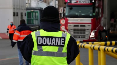French customs officials monitor haulage trucks disembarking from a cross channel ferry from the UK at the Port of Calais in France. Bloomberg