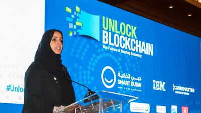 Aisha Bin Bisher, the director general, Smart Dubai Office, speaks at the Unlock Blockchain Forum. Chris Whiteoak / The National