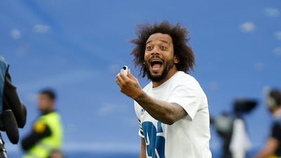 Real's Marcelo celebrates with the trophy. Reuters