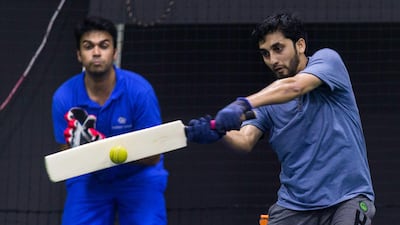 A group of men play indoor cricket at the Insportz Club in the Al Quoz area of Dubai. Christopher Pike / The National
