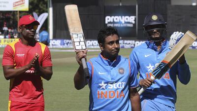 Ambati Rayudu, left, scored a career-best unbeaten 124 as India recovered from a poor start and beat Zimbabwe. Philimon Bulawayo / Reuters