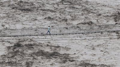 A pedestrian bridge over the swollen Trishuli river in Dhading district, Nepal. EPA