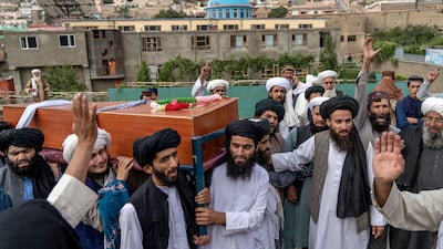 Mourners carry the body of a victim of a mosque bombing in Kabul. All photos: AP