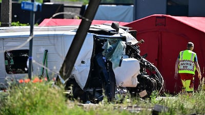 Responders at the site after a train crashed into a school minivan in Belgium on Tuesday. AFP