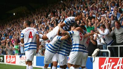 Charlie Austin of Queens Park Rangers celebrates with his teammates after scoring the eventual winner in their 1-0 victory over Sunderland in the Premier League on Saturday. Paul Gilham / Getty Images