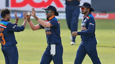 India's Kuldeep Yadav, left, and Shikhar Dhawan, celebrate the dismissal of Sri Lanka's Bhanuka Rajapaksa.