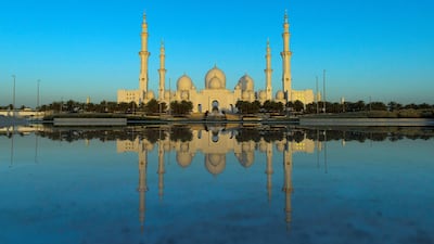 Sheikh Zayed Grand Mosque is seen during sun rise on the first day of the holy month of Ramadan from Wahat Al Karama, the martyrs' memorial, in Abu Dhabi. May 27, 2017. Christopher Pike / The National