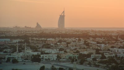 The view from Sheikh Zayed Road towards the Burj Al Arab at sunset in 2002. Construction of the Madinat Jumeirah was under way to the left of the Jumeirah Beach Hotel. Photo: Richard Parry