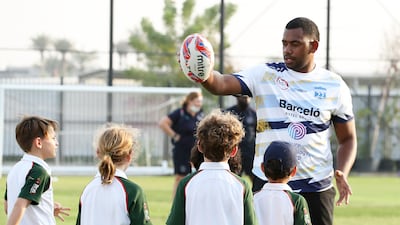 A Speranza 22 talks to players at the training session in Dubai.