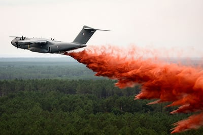 A French Air Force A400M transport aircraft makes its first drop of fire-retardant chemicals over the wildfire near Lacanau, France. AFP