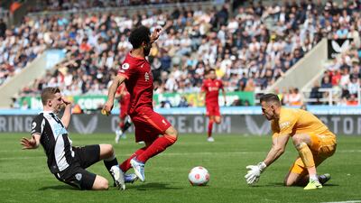Newcastle's Martin Dubravka collects the ball from Mohamed Salah. Action Images