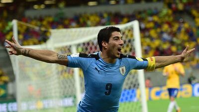 Uruguay’s Luis Suarez celebrates after scoring against Brazil during their Russia 2018 Fifa World Cup South American Qualifiers’ football match, in Recife, northeastern Brazil, on March 25, 2016. AFP PHOTO / CHRISTOPHE SIMON