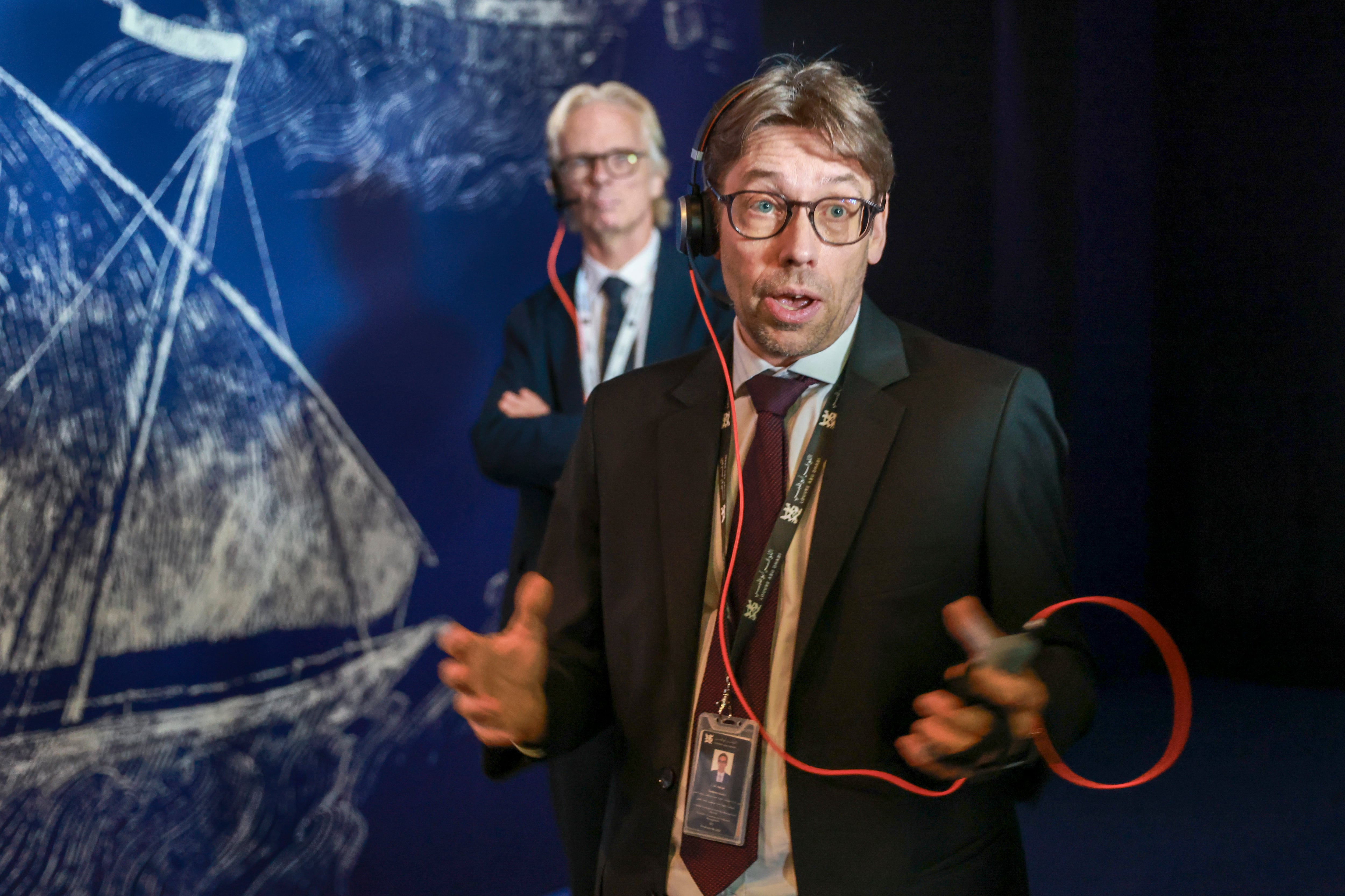 Guilhem Andre, foreground, director of scientific, curatorial and collections management at Louvre Abu Dhabi, and Pierre Baptiste, director of collections and curatorial staff at the Guimet National Museum of Asian Arts in Paris. Victor Besa / The National