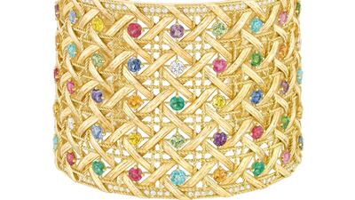 A woven yellow gold My Dior cuff, with diamonds and coloured gemstones, has an estimate of £30,000-£50,000. Courtesy Sotheby's