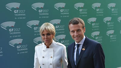 Brigitte, wearing a white two-piece Louis Vuitton suit, in Sicily on May 26, 2017. AFP
