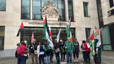 Pro-Palestinian protesters gathered outside Westminster Magistrates' Court as Daniel Day made his first appearance on Monday. PA