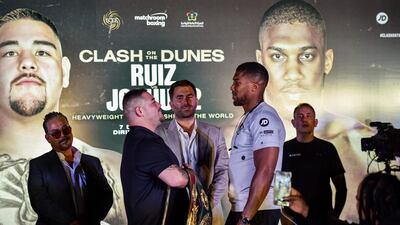 Andy Ruiz Jr and Anthony Joshua square off during the "Clash on the Dunes" press conference. AFP