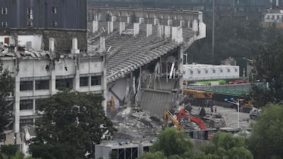 Workers demolish the Workers' Stadium in Beijing. AFP