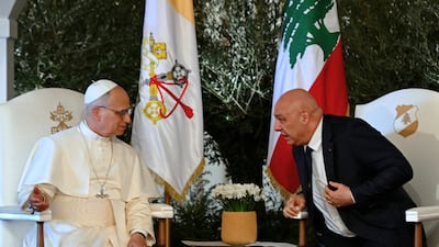 Pope Leo speaks to Lebanese President Joseph Aoun during a farewell ceremony at the airport. AP