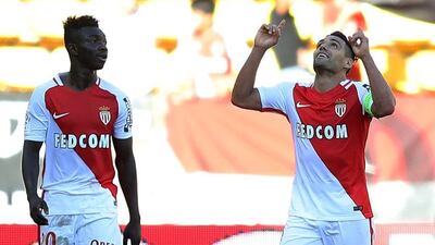 Radamel Falcao, right, celebrates after opening the scoring for Monaco in the 3-0 Ligue 1 victory over Rennes. Valery Hache / AFP