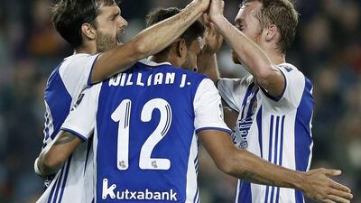Real Sociedad midfielder Xabi Prieto, left, celebrates after scoring the second goal against Barcelona. Andreu Dalmau / EPA